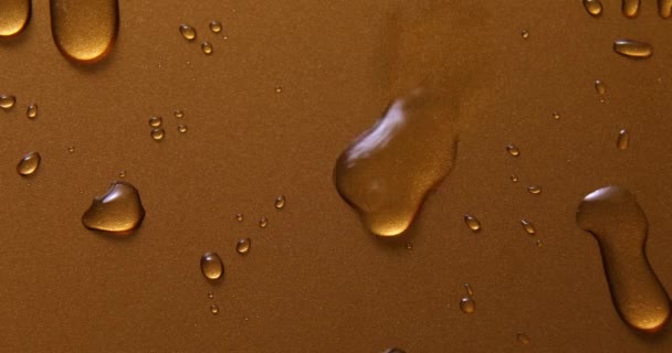 Absztrakt Vízcseppek Arany Bronz Háttér Makró Buborékok Közelről Kozmetikai Hidratáló — Stock videók