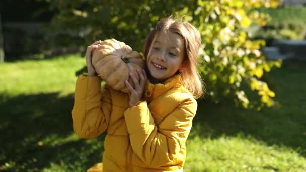 Orange Pumpkin Hands Girl Autumn Park Cute Young Girl Has — Vídeo de stock