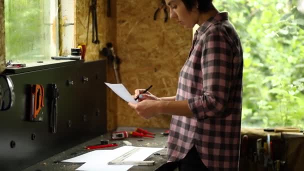 Woman Architect Check Plan New Apartment Design Workshop Design Project — Stockvideo