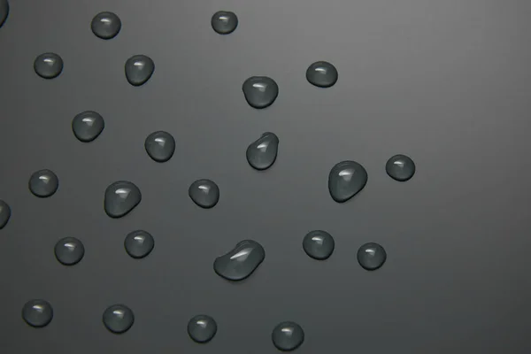 Abstrakte Wassertropfen Auf Grauem Hintergrund Makro Blasen Nahaufnahme Kosmetische Feuchtigkeitsspendende — Stockfoto