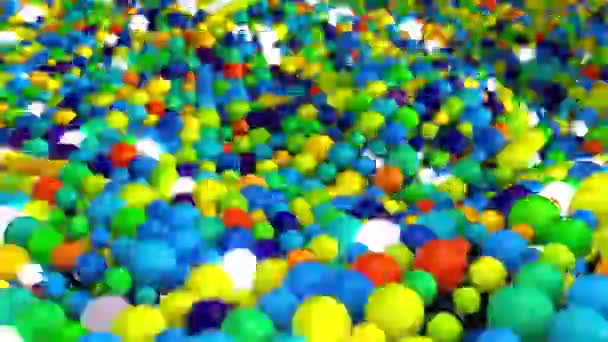 Random mound of colored spheres with glow — Stockvideo