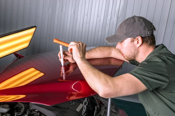 Removing dents on a car body without painting. PDR. — Stok fotoğraf