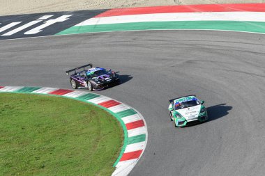 Mugello Circuit, Italy - October 8, 2021: Porsche 718 Cayman GT4 of Team Ebimotors driven by Mattia Di Giusto - Pera during Race of Italian Championship GT