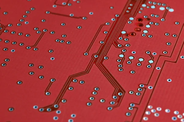 close-up of red printed electronic board. selective focusing