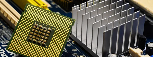 close-up on computer cpu over a motherboard. long banner