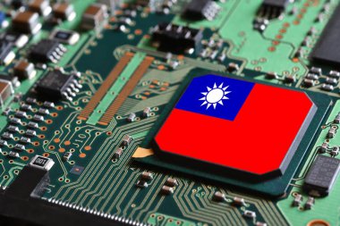 Flag of the Republic of China or Taiwan on semiconductor chip or microchip on a motherboard. Taiwan manufacturing chip industry battle between US - China.