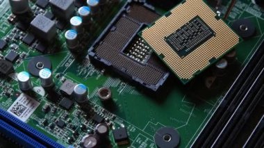 Detail of a CPU Processor over his Socket on a Motherboard. Printed Circuit Board - Computer Motherboard with Components. Shot with Rotation Movement