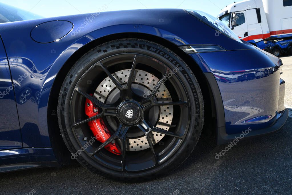 Mugello Circuit, Italy 23 September 2022: Detail of alloy wheel of a Porsche 911 GT3 on display in the Paddock of Mugello circuit during Porsche Sports Cup Suisse event 2022. Italy.