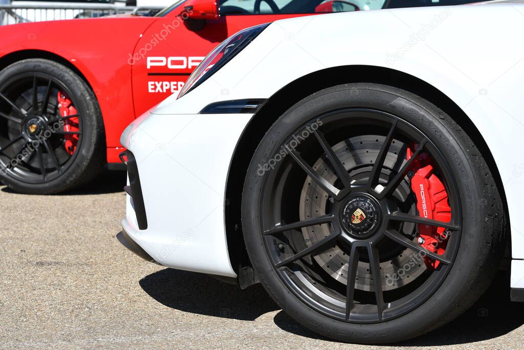Mugello Circuit, Italy 23 September 2022: Detail of alloy wheel with red caliper of a Porsche 911 GT3 on display in the Paddock of Mugello circuit during Porsche Sports Cup Suisse event 2022. Italy.