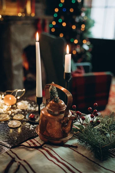 Decorated New Years table with candles and antique teapot — 图库照片