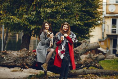 Elegant women in a autumn city