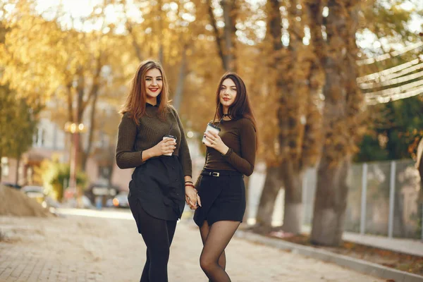 Elegant women in a autumn city — Stok fotoğraf