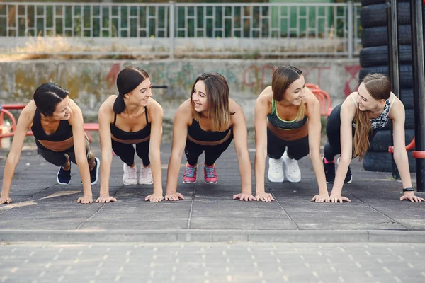 Sports girls training in a summer park — 스톡 사진