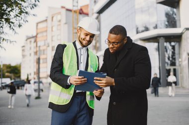 Property developer and black man discussing future flat
