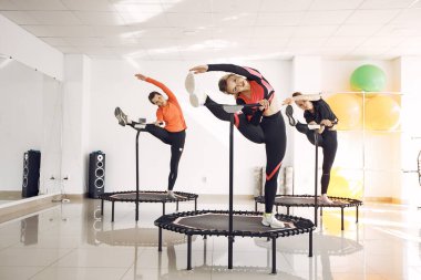Jumping young women on a trampoline