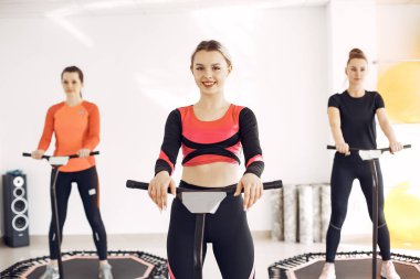 Jumping young women on a trampoline