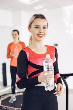 Jumping young women on a trampoline