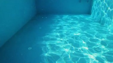 A POV shot of a person swimming in the pool