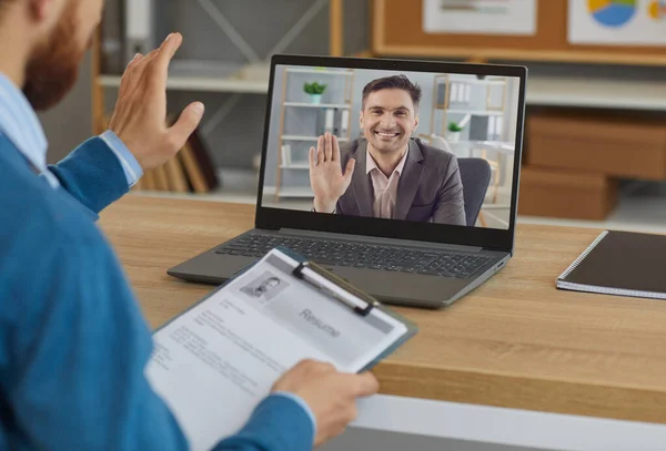 Smiling employer or hiring manager greeting job candidate in virtual job interview — Stock Photo, Image