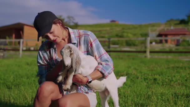 Woman farmer takes care of her animals — Stockvideo