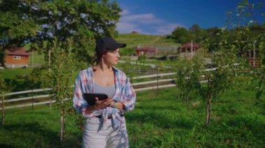 Farmer typing results after inspecting orchard