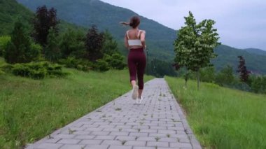 run in nature, cardio workout for good health condition, woman is practicing physical activity