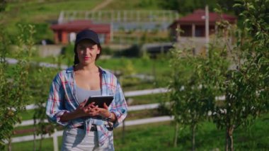 Smiling woman farmer in the garden