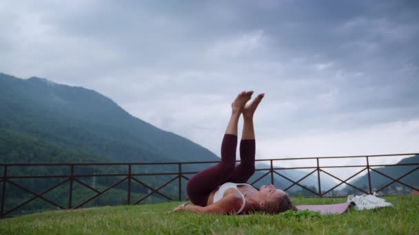 Woman doing yoga and legs up pose — Stok video