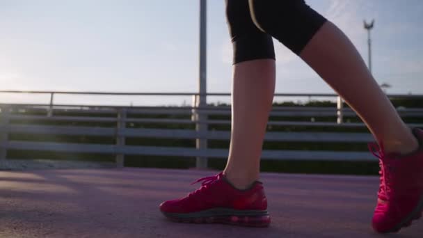 Sportswoman walking on running track — Stok video