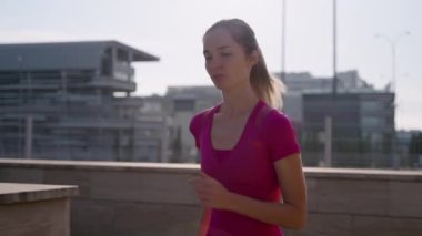 tired sporty woman during morning jogging in city, portrait of lady in morning time
