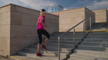 Running up the stairs as cardio workout