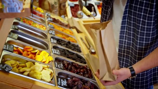 Man Stall Dried Fruit Candied Nuts Taking Dried Pears Putting — Stock Video