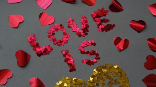 Love is a yellow heart on a gray background on red Valentines Day — Stok Video