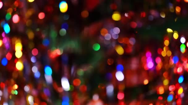 Christmas bokeh. Unfocused lights of new year garlands. Blurry holiday lights background — Stock Video