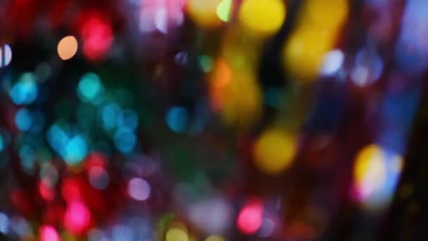 Weihnachtsbokeh. Unfokussierte Lichter von Neujahrsgirlanden. Verschwommene Urlaubsbeleuchtung Hintergrund — Stockvideo