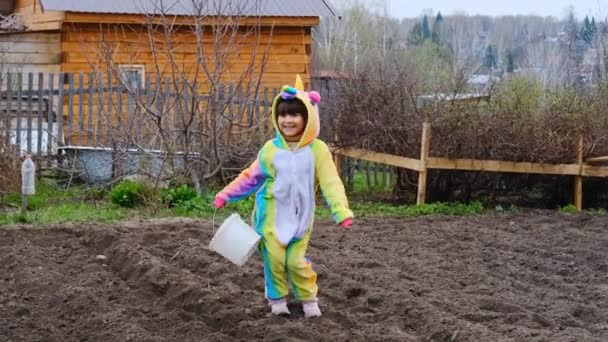 Child girl in unicorn costume for Halloween, party dancing and having fun. — Stock Video