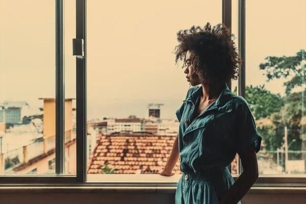 Pensive Young Black Female Blue Overalls Curly African Hair Standing — Stock Photo, Image