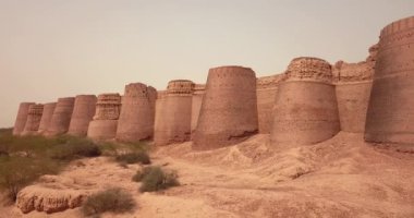 4K Aerial Footage View to the Young Boy near Derawar Fortress in Cholistan Desert, Pakistan