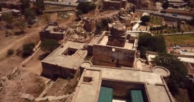 4K Aerial Footage View to the Shri Katas Raj complex of several Hindu temples, Punjab, Pakistan