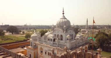 4K Aerial Footage View to the Samadhi of Ranjit Singh with the City View to Lahore, Pakistan