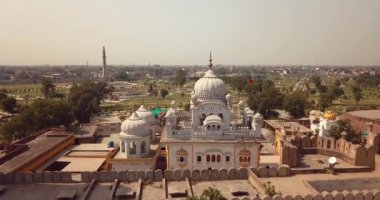4K Aerial Footage View to the Samadhi of Ranjit Singh with the City View to Lahore, Pakistan