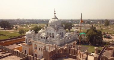 4K Aerial Footage View to the Samadhi of Ranjit Singh with the City View to Lahore, Pakistan