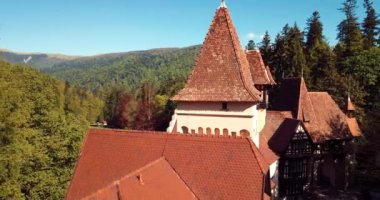 4K Aerial Footage of the Ancient Romanian Castle in the Heart of Awesome Autumn Green Forest, Pelisor