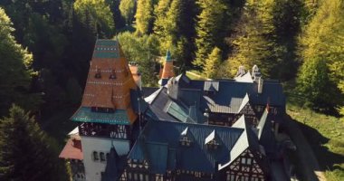 4K Aerial Footage of the Ancient Romanian Castle in the Heart of Awesome Autumn Green Forest, Pelisor