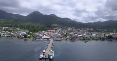 4K Aerial Footage View to the Green and Natural Portsmouth Coastline and Dock of the Dominica Island, Caribbean Sea