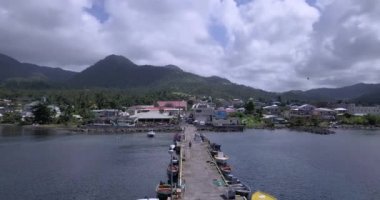 4K Aerial Footage View to the Green and Natural Portsmouth Coastline and Dock of the Dominica Island, Caribbean Sea