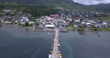 4K Aerial Footage View to the Green and Natural Portsmouth Coastline and Dock of the Dominica Island, Caribbean Sea