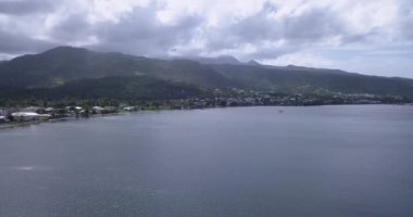 4K Aerial Footage View to the Green and Natural Portsmouth Coastline and Dock of the Dominica Island, Caribbean Sea
