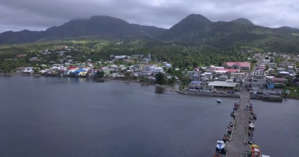 4K Aerial Footage View to the Green and Natural Portsmouth Coastline and Dock of the Dominica Island, Caribbean Sea