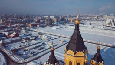 4K Aerial Footage of the Winter View to Alexander Nevsky Church with the background to the snowy Nizhny Novgorod city, Russia